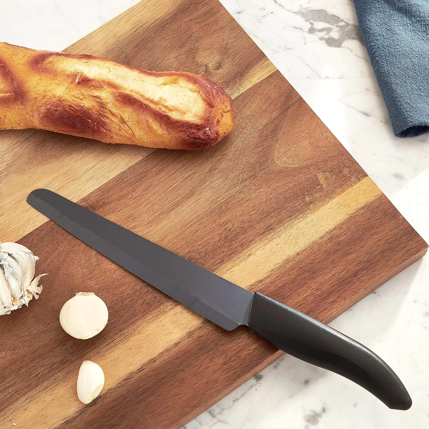 Kyocera Advanced Ceramic Revolution Series 7-inch Serrated Slicing/Bread Knife, Black Handle, Black Blade